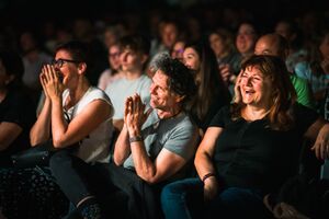 The laughing audience at the international stand-up comedy festival <!--LINK'" 0:327-->, Ljubljana 2022. Author: Jaka Škrlep