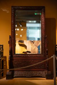A Chinese wooden mirror in the Skušek Collection, <!--LINK'" 0:39-->.