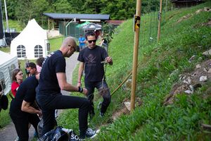 The rock band <!--LINK'" 0:801--> posed alongside their tree in the <i>Rockers' Tree Alley</i> at the <!--LINK'" 0:802--> festival in 2023. Author: Marko Čuk