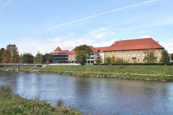 The building of the new Celje Central Library seen from the banks of the Savinja River in Celje. STVAR architects, 2011