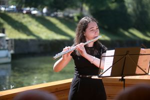 Ana Votupal partaking in a series of classical music concerts held at the Ljubljanica river, <!--LINK'" 0:361-->, 2016