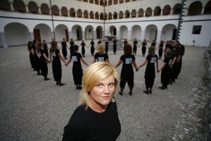 Conductor <!--LINK'" 0:183--> with <!--LINK'" 0:184--> choir in the <!--LINK'" 0:185--> courtyard at Kostanjevica na Krki