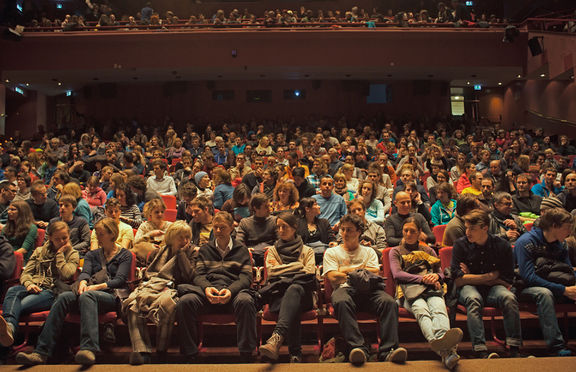 The gathered audience for a lecture by the legendary female climber Lynn Hill, taking place at Cankarjev dom, 2015