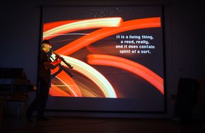 <!--LINK'" 0:1048--> during his multimedia act, merging photography, poetry and solo saxophone at <!--LINK'" 0:1049-->, 2014