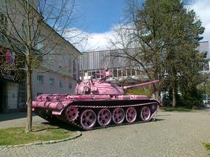 The tank from the Ten-Day War in Slovenia (1991) in front of the <!--LINK'" 0:104-->. On the eve of the International Women's Day in 2012 it was sprayed pink by the unknown activists and became a new popular landmark in Ljubljana. It is owned by the <!--LINK'" 0:105--> and was transferred to the <!--LINK'" 0:106--> only a few months after the action. The pink paint was removed.