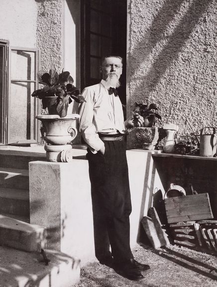 Jože Plečnik, standing in front of the cylindrical extension of his house in Trnovo, 1926.