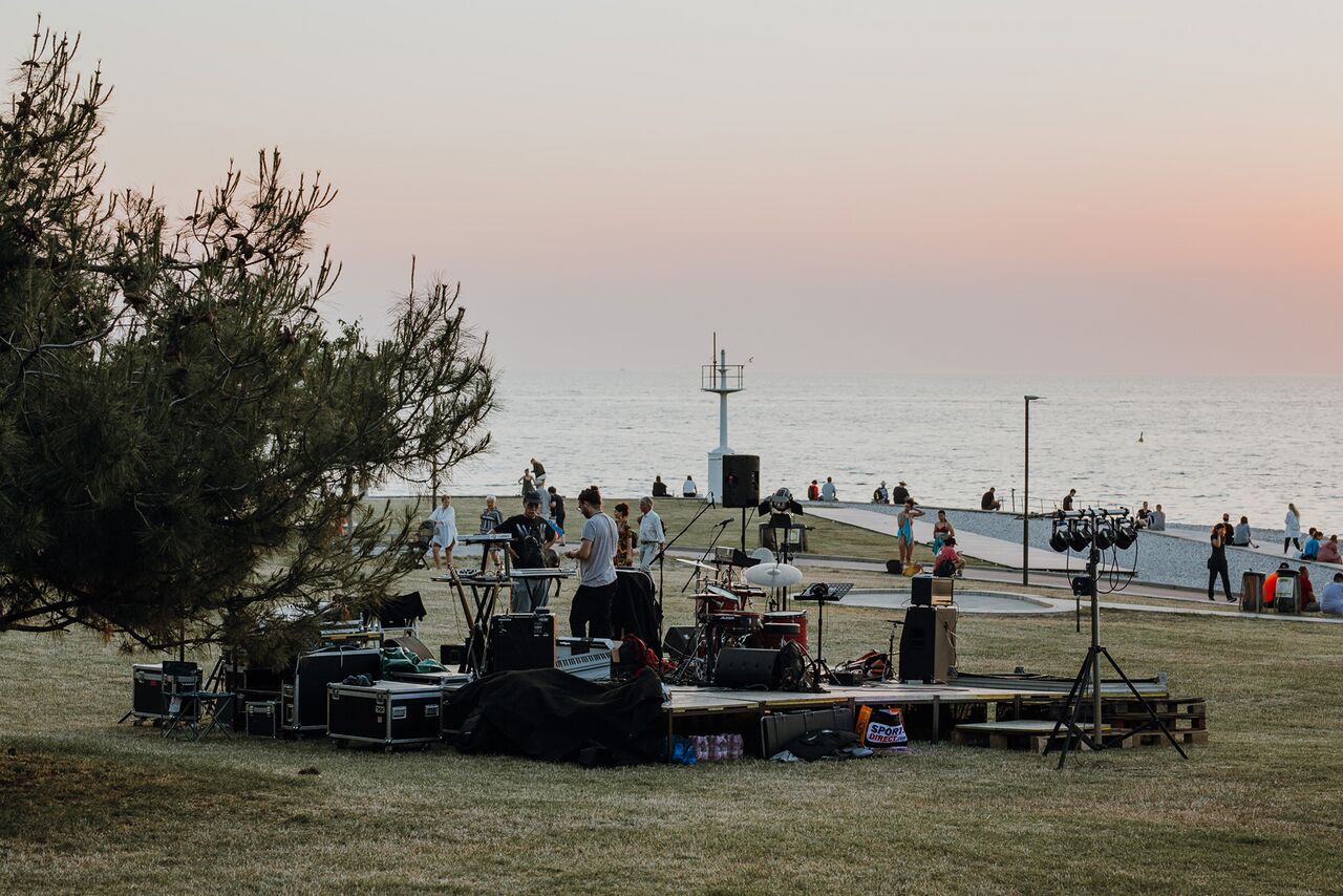 Musicians preparing for an evening performance at the Lighthouse, Kino Otok - Isola Cinema Festival 2022. Author: Amadeja Smrekar