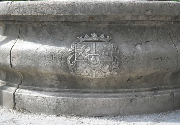 The Codelli family coat of arms on the well in front of the Kodeljevo Castle, 2012