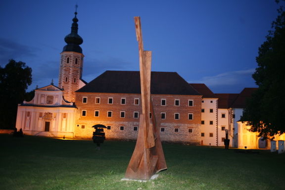 Exterior of Božidar Jakac Art Museum in the former Kostanjevica Monastery, Kostanjevica na Krki. In front: a sculpture from the Forma Viva Open Air Wood Sculpture Collection