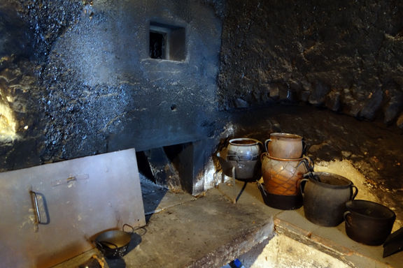 Black kitchen (Črna kuhinja) with an open fireplace and bread oven, Birthplace of France Prešeren, 2013