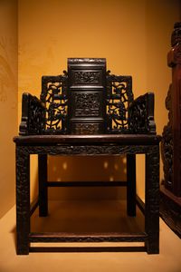 An exquisitely-carved Chinese wooden chair in the Skušek Collection, <!--LINK'" 0:33-->.