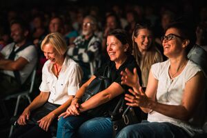 The laughing audience at the international stand-up comedy festival <!--LINK'" 0:326-->, Ljubljana 2022. Author: Jaka Škrlep