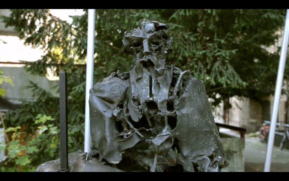 A still frame from Kulturnik.si promo video featuring a bust of Rihard Jakopič, the leading Slovene Impressionist painter and patron of arts. A public sculpture created by Janez Boljka in 1969 is located in front of the Jakopič Gallery. Shot in 2013.