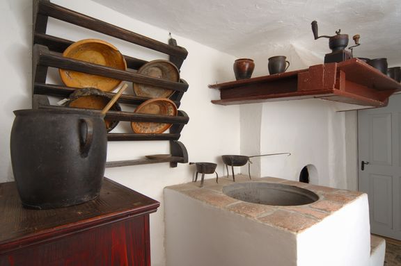 On the ground floor of France Bevk Homestead are a vestibule and a kitchen with a hearth and an inbuilt pig kettle