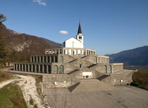 Completed in September 1938, inaugurated by Benito Mussolini, the Italian ossuary contains the mortal remains of 7014 identified and unknown Italian soldiers who fell on the Soča Front. Part of the <!--LINK'" 0:92--> outdoor museum tour.