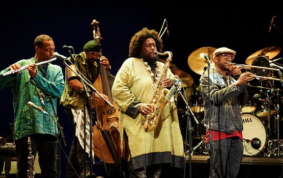 Jazz superstar Kamasi Washington and his band on the stage of Verdi Theatre in Gorizia, Italy, during his performance at Glasbe sveta 2019.