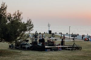 Musicians preparing for an evening performance at the Lighthouse, <!--LINK'" 0:229--> 2022. Author: Amadeja Smrekar