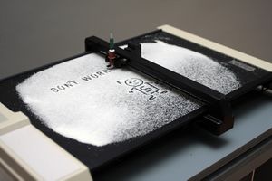<i>Nanoplotter</i> uses a plotter, an obsolete printing machine from the 1980s, adapted to an uncommon operation. By the artist collective <!--LINK'" 0:49--> at the <i><!--LINK'" 0:50--></i>, <!--LINK'" 0:51-->, Ljubljana, 2010.