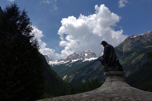 A statue of Julius Kugy with the orientation toward Jalovec Mountain. Julius Kugy (1858-1944) was a mountaineer and researcher of Julian Alps, <!--LINK'" 0:146-->, 2014