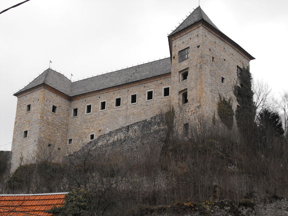 Kostel Castle on a steep hill above the Kolpa River.