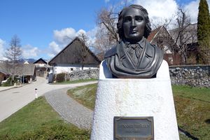France Prešeren bust in Vrba, the <!--LINK'" 0:237--> the background. A bronze replica of a plaster statue created in 1865 by <!--LINK'" 0:238-->, 2013